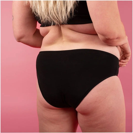 Flove svart lekkasjesikker truse på kvinne sett bakfra
